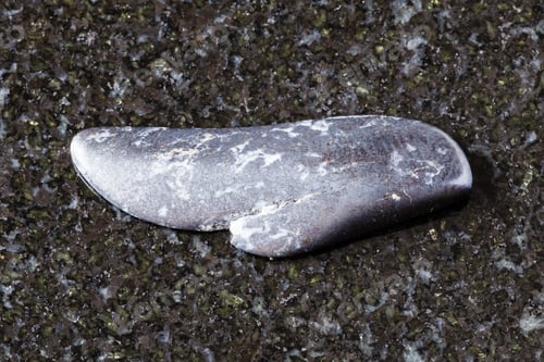 Preview: sample of polished braunite mineral on black