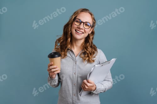 Preview: Smiling attractive young woman standing with notepad