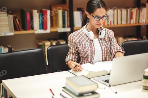 Preview: Female student study in the college library.