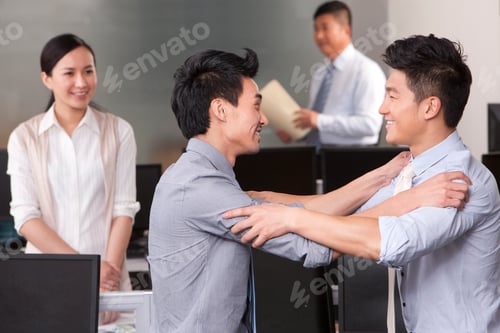 Preview: Businessmen with their hands on each other's shoulders