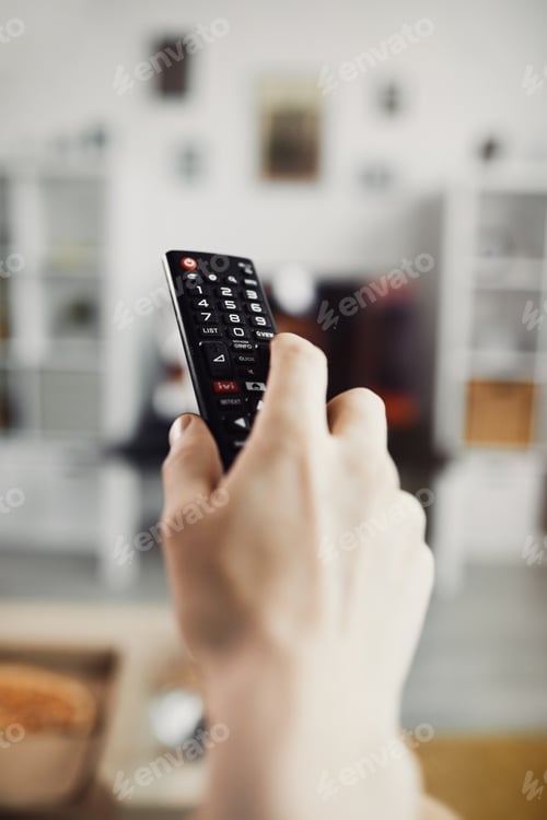 Preview: Closeup Hand Holding TV Remote