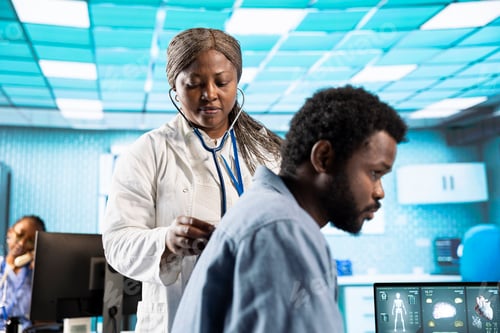 Preview: African american doctor does a respiratory examination checkup with stethoscope