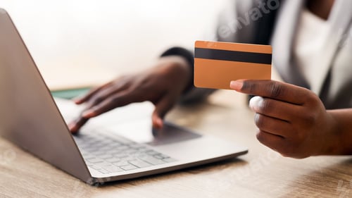Preview: Unrecognizable Businesswoman Using Credit Card And Laptop At Workplace In Office.