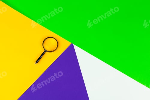 Preview: Magnifying glass on bright colored background flat lay