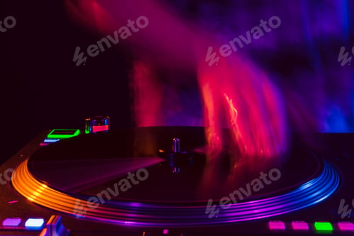 Preview: Close up of DJ hands on dj console mixer during concert in the club