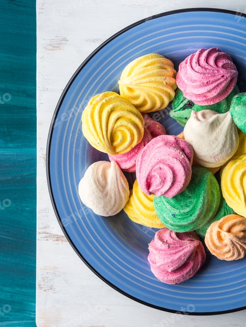 Preview: Colorful meringue on blue ceramic plate