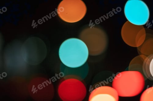 Preview: Background of colorful bokeh lights with a dark background