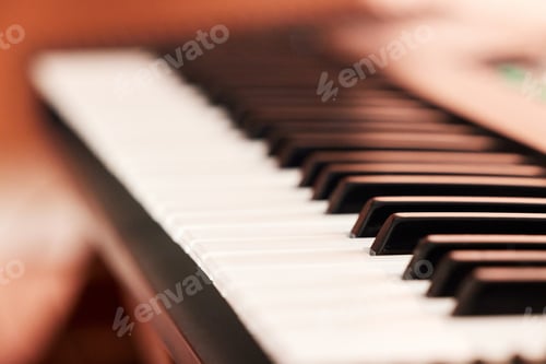 Preview: Closeup shot of black and white piano keys. Above shot of a sharp and flat piano keys. Music can mo