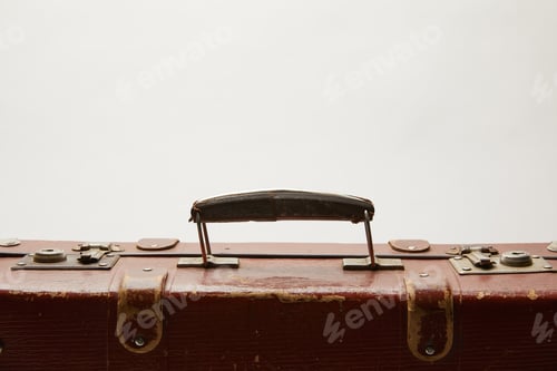 Preview: lather brown suitcase with copy space isolated on grey