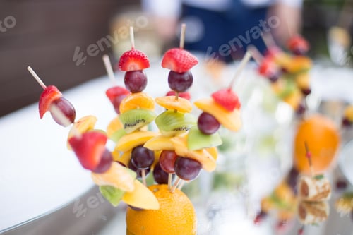 Preview: Colorful Fruit Skewers Served at a Reception