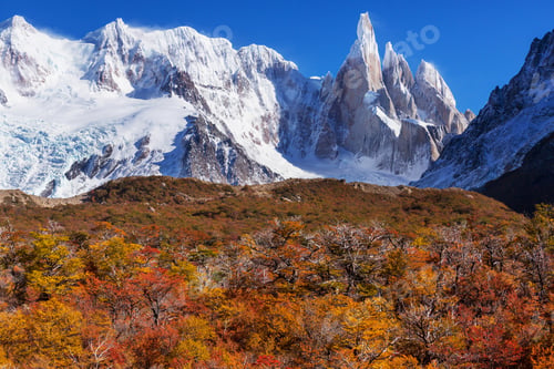 Majestic Mountain Peaks with Autumn Trees Landscape