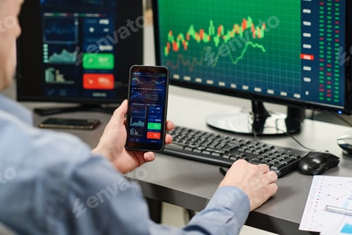 Preview: Broker Watching Charts On Smartphone