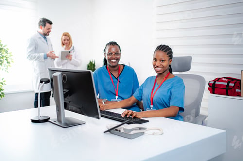 Preview: Diverse medical team working in hospital reception area