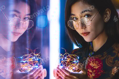 Preview: Pretty asian woman portrait with led lights