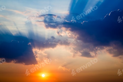 Preview: Sunset over clouds with blue and orange colors as background