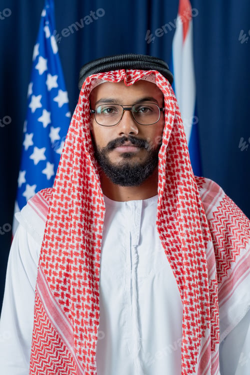 Preview: Young serious political leader in national clothes and eyeglasses