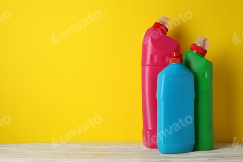 Preview: Blank bottles with different detergent on yellow background