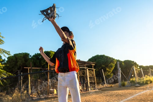 Preview: Young boy playing baseball, catching ball with glove