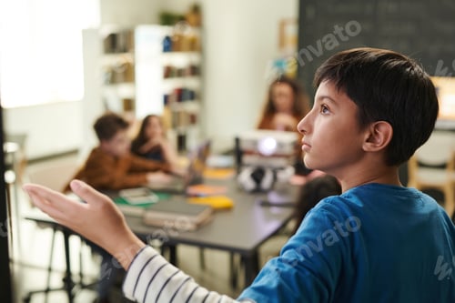 Preview: Boy Pointing at Blackboard
