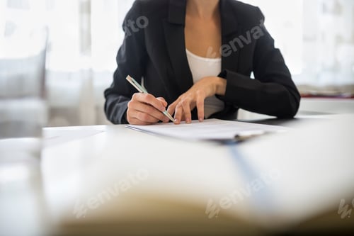Preview: Professional Woman Signs Document at Bright White Desk