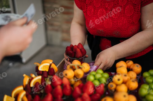 Preview: Woman selling fruits at street market