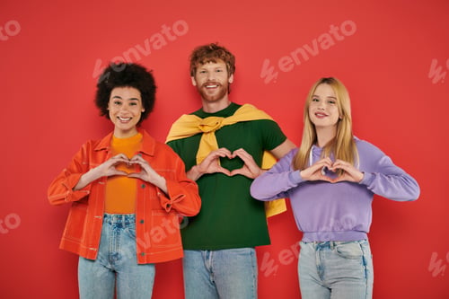 Preview: open relationship, polygamy concept, three interracial lovers showing heart sign with hands