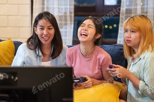 Preview: Three Young Women Cheerfully Playing Video Games