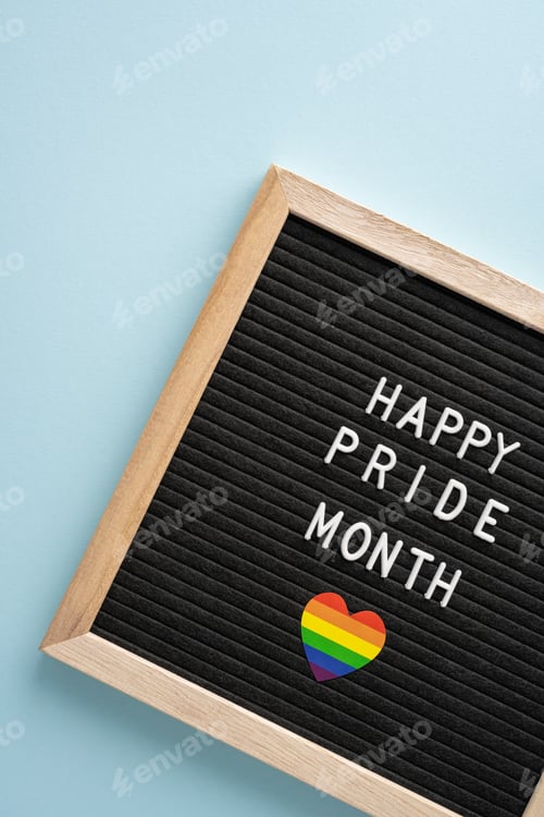 Preview: Vertical photo of black letter board with 'Happy Pride Month' message in white letters