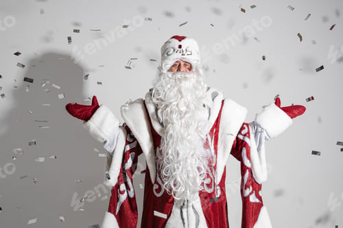 Preview: Cheerful Father Frost outstretching arms under confetti.