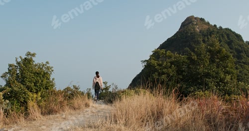 Preview: Woman go hiking to the top of the mountain