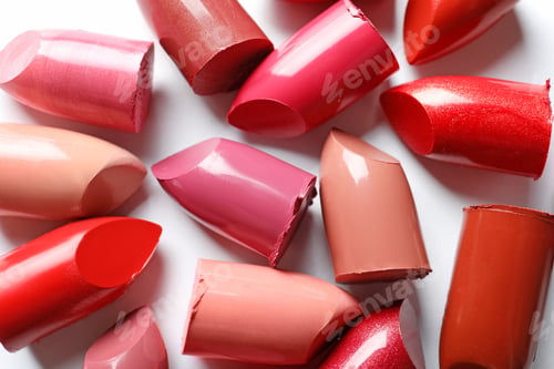 Preview: Collection of lipsticks on white background, top view