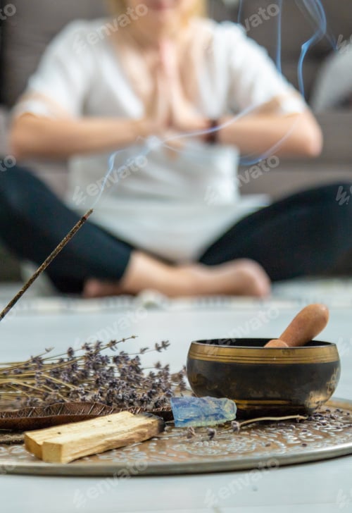 Preview: Woman doing yoga at home and aromatherapy. Selective focus.
