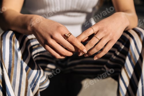 Preview: Crop woman hands with rings on the street