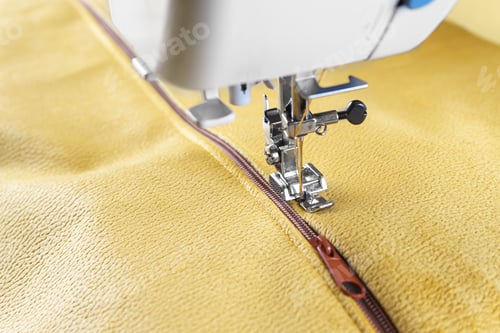 Preview: Modern Sewing Machine With Yellow Velours Fabric Close Up