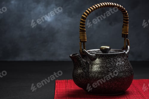 Preview: Traditional Tea pot on red bamboo