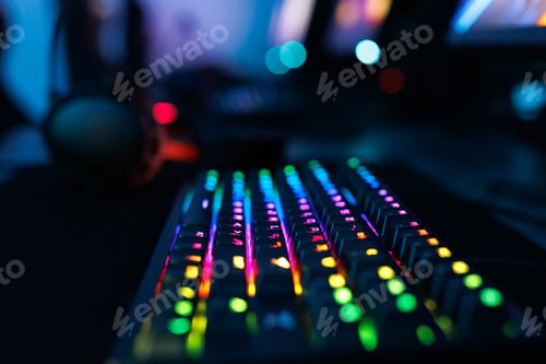 Preview: Computer mouse, keyboard, neon-illuminated headphones for esports, concept of a professional game.