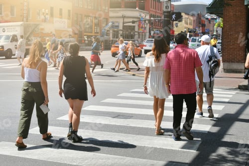 Preview: Downtown Nashville TN with traffic and Lower Broadway in the background and people crossing street