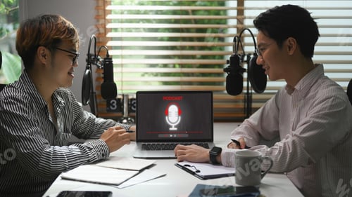 Vista previa: Male radio host using condenser microphone recording voice over radio interview.
