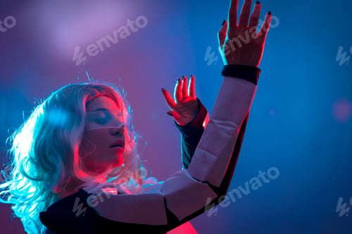 Preview: Beautiful woman looking through futuristic glasses, purple background, future and virtual reality