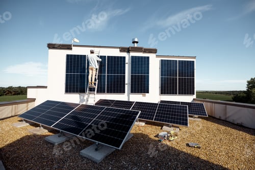 Preview: Man installing solar panels on the roof of his house