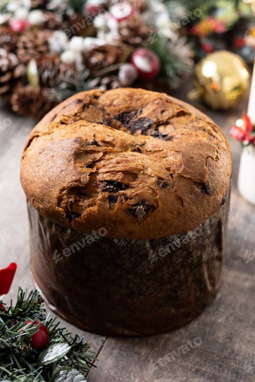 Preview: Christmas panettone cake with chocolate chips on wooden table