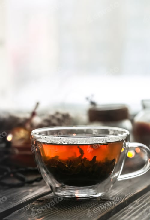 Preview: Transparent Cup of tea on wooden background
