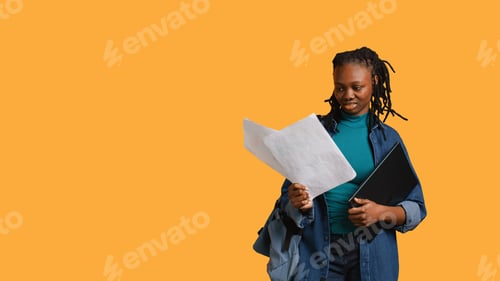 Preview: Employee rolling eyes, looking at report pages, feeling bored, studio background