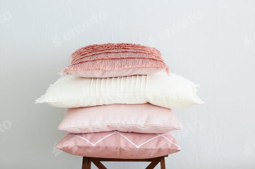 Preview: Pink and white pillows on the wall background