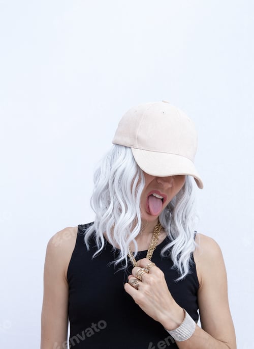 Preview: Transgender Woman fashion portrait in stylish beige casual velvet cap. Spring summer