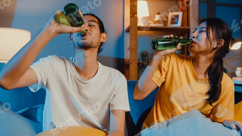 Preview: asian couple looking at camera enjoy night party event online sit couch video call with friends.