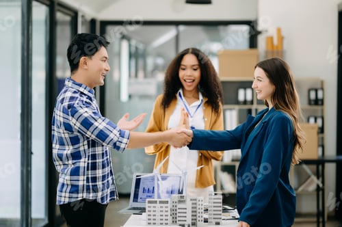 Preview: business people shaking hands during a meeting in office