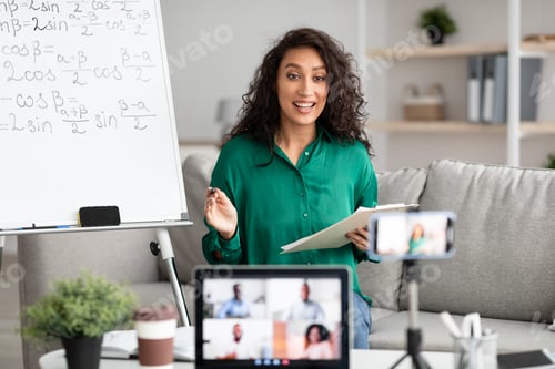 Preview: Young teacher explaining math online making video call