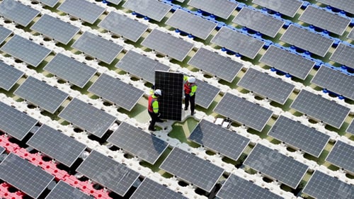 Preview: Floating solar panels providing renewable energy. Aerial view floating on solar cells
