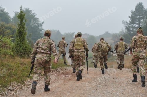 Preview: A disciplined and specialized military unit, donned in camouflage, strategically patrolling and